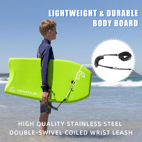 boy holding a bodyboard looking into the ocean