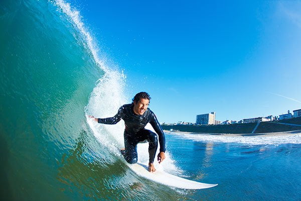 expert surfing on the blue ocean