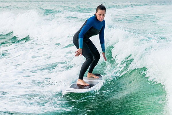 woman learning how to surf